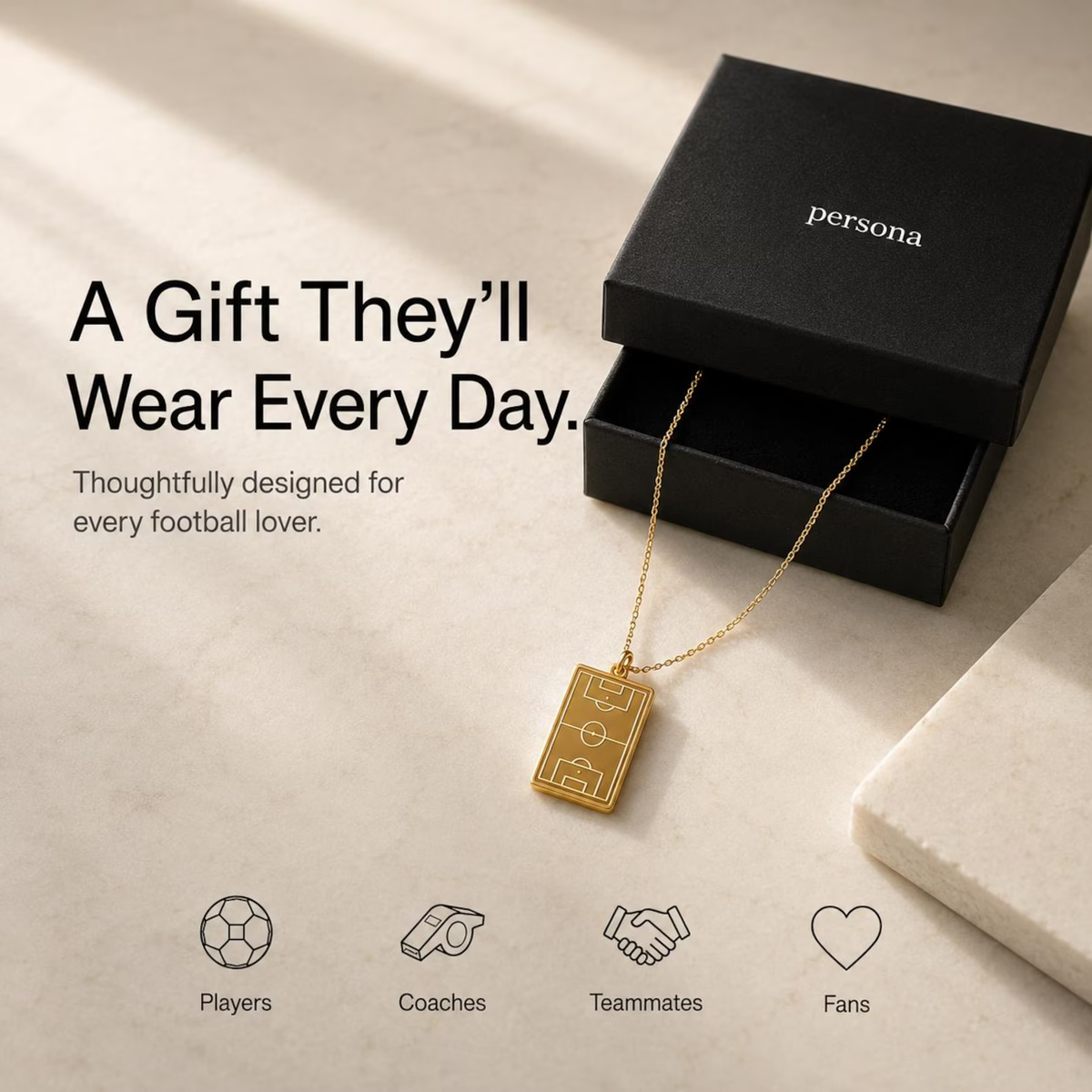 Gold soccer pendant presented in a Persona gift box