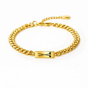 Gold Cuban bracelet with a crossed hockey sticks bar