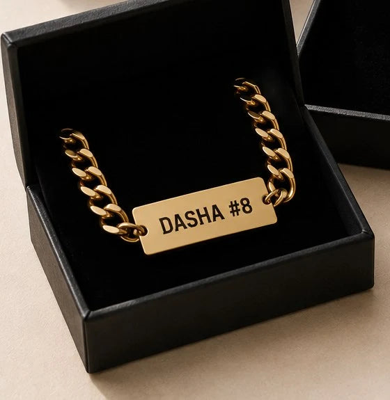 Athlete wearing a pendant engraved with a name and number