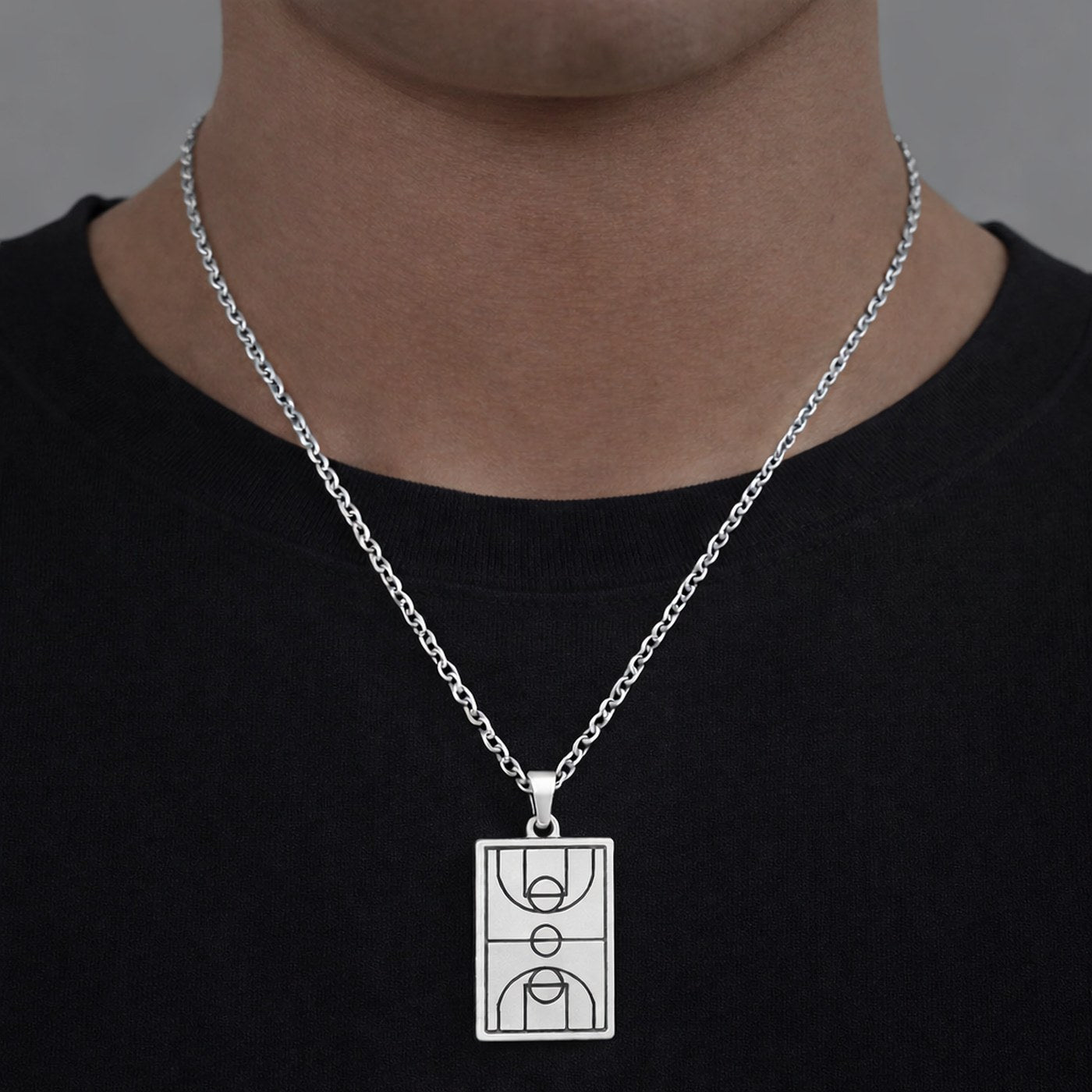Silver basketball court pendant worn